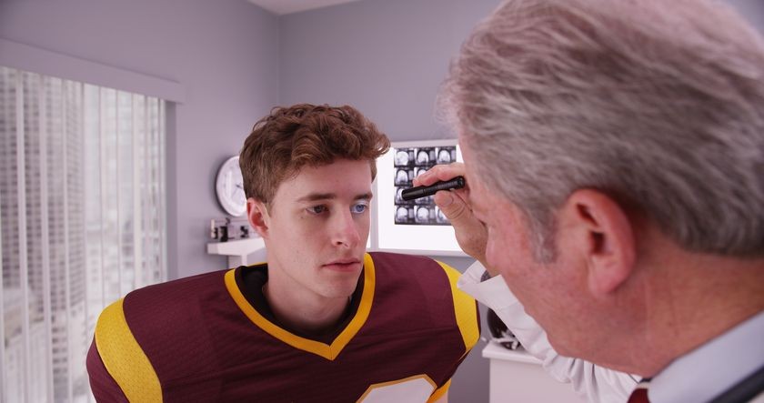 doctor-examining-football-player.jpg